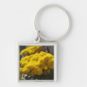 Yellow marigolds bask in sunlight key ring