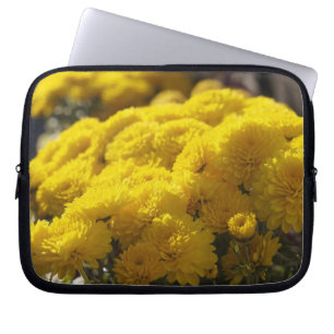 Yellow marigolds bask in sunlight laptop sleeve