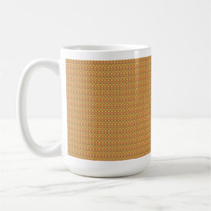 Yellow, orange, and brown wrapping paper sheets ar coffee mug