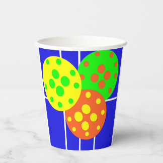 Yellow, orange, & green pickleballs on blue court paper cups