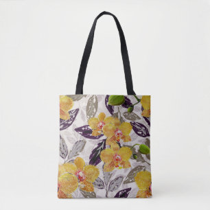 Yellow orange orchids. tote bag