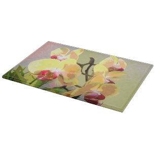 Yellow Orchids in the afternoon sun Cutting Board