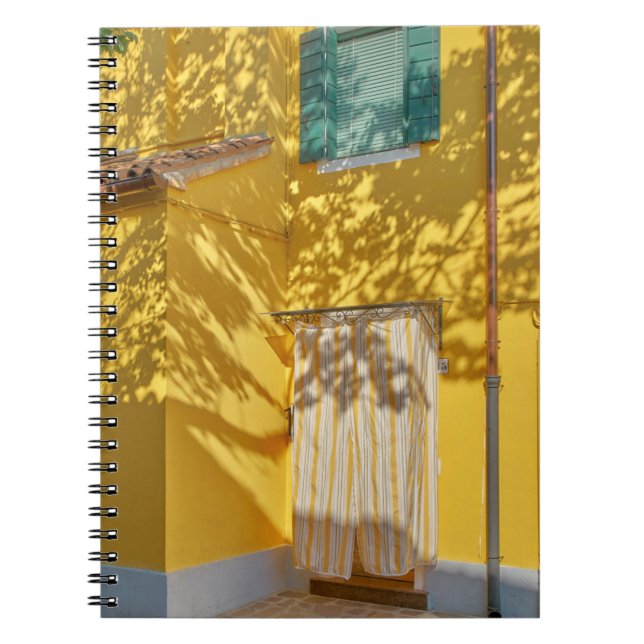 Yellow painted concreted building notebook (Front)