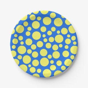 Yellow peas on a sky blue background paper plate