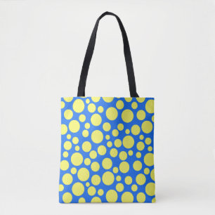 Yellow peas on a sky blue background tote bag