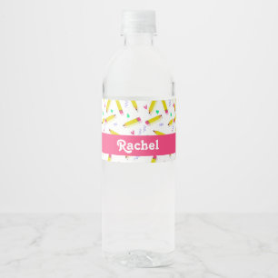 Yellow pencils and scrabbles on white water bottle label