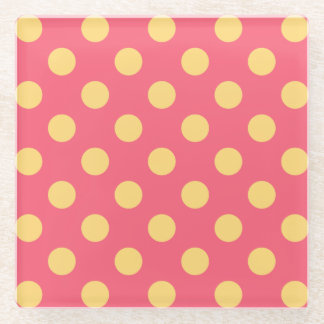 Yellow polka dots on coral glass coaster