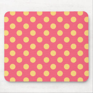Yellow polka dots on coral mouse pad