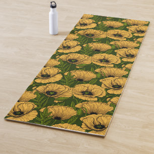 Yellow poppies on dark green yoga mat