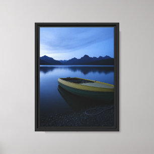 Yellow Rowboat on Calm Lake at Dusk with Mountains Canvas Print