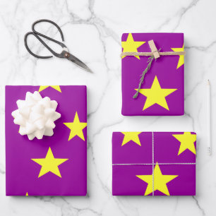 Yellow stars on purple wrapping paper sheet