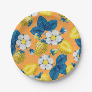 Yellow strawberries on orange paper plate