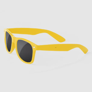 Yellow sunglasses with dark lenses are centred 