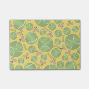 Yellow tennis balls rackets and nets post-it notes
