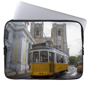 Yellow tram on Lisbon Cathedral in Portugal Laptop Sleeve