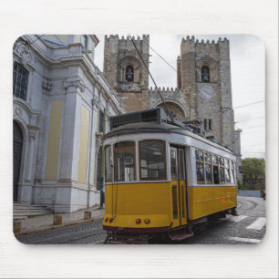 Yellow tram on Lisbon Cathedral in Portugal Mouse Pad