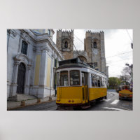 Yellow tram on Lisbon Cathedral in Portugal