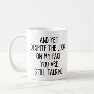 Yet Despite the Look on My Face You Are Still Talk Coffee Mug