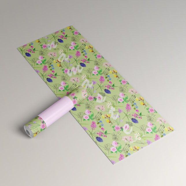 Yoga for women with delicate flowers on green yoga mat (Creator Uploaded)