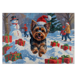 Yorkshire Terrier in Snow with Christmas Hat Cutting Board