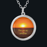 You are my sunshine necklace<br><div class="desc">This lovely quote along with this picture of the sunset that I took,  will win her/his heart.</div>