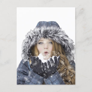 Young beautiful girl in winter postcard