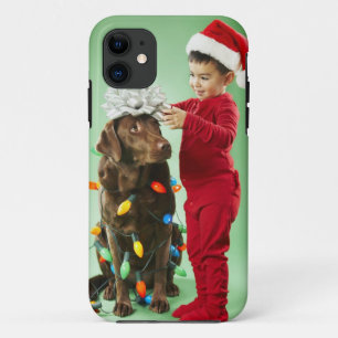 Young boy wrapping Christmas lights around a dog Case-Mate iPhone Case