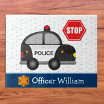 Young Boy's Police Officer Puzzle<br><div class="desc">Give your special little police officer his own custom puzzle! Puzzle features a large police car, a stop sign, a badge, and your young officer's first name. Behind the police items are soft blue polka dots and a dark blue ribbon. Any young policeman is sure to love this bright and...</div>