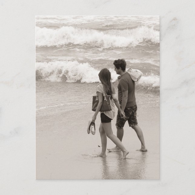 Young couple walking on the beach postcard (Front)