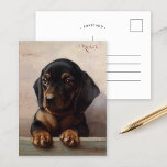 Young Dachshund | Carl Reichert Postcard<br><div class="desc">Young Dachshund | Carl Reichert’s Young Dachshund is a heartwarming portrait of a dachshund puppy, showcasing the artist’s remarkable attention to detail and ability to capture the animal’s endearing expression. The puppy’s soulful eyes and soft fur are rendered with exquisite precision, set against a neutral background that emphasizes the subject’s...</div>