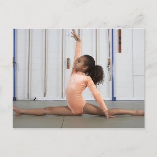 Young girl gymnast practicing her floor postcard