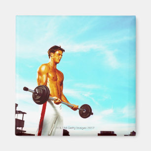 Young man exercising with barbells magnet