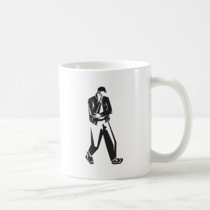 young man talking on a cell phone while walking coffee mug
