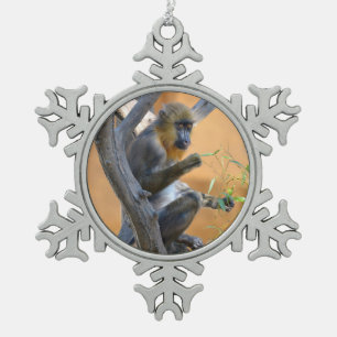 Young mandrill sitting in a tree   snowflake pewter christmas ornament