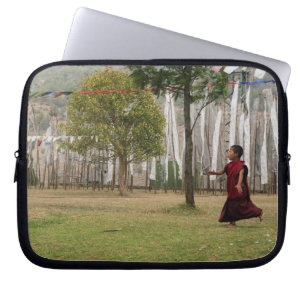 Young monk and prayer flags laptop sleeve