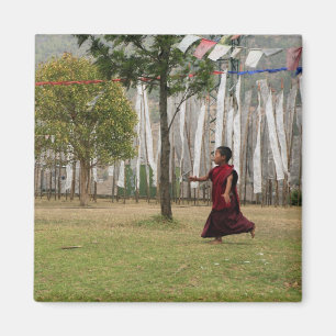 Young monk and prayer flags magnet