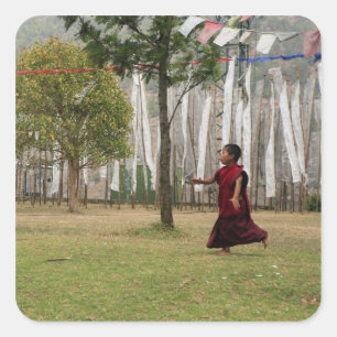 Young monk and prayer flags square sticker