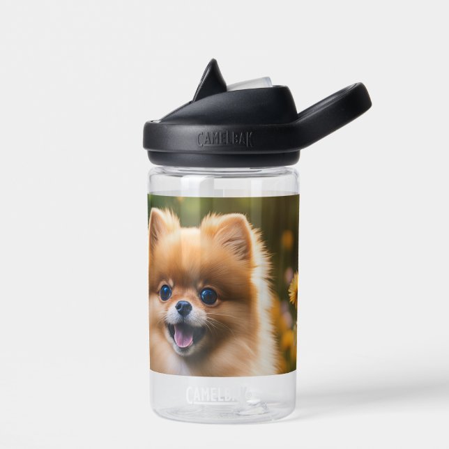 Young Pomeranian Puppy in Flower Field  Water Bottle (Left)