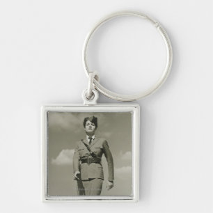 Young woman in military marching on rooftop key ring