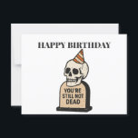 You're Still Not Dead — Funny Dark Humor Birthday Postcard<br><div class="desc">This isn’t your average birthday card—it’s a celebration of survival with a side of snark. The "You're Still Not Dead" card features a clean vector-style illustration of a classic ivory skull wearing a cheeky orange-striped party hat, rising from a muted beige tombstone boldly engraved with those iconic words. It’s equal...</div>