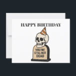 You're Still Not Dead — Funny Dark Humor Birthday Postcard<br><div class="desc">This isn’t your average birthday card—it’s a celebration of survival with a side of snark. The "You're Still Not Dead" card features a clean vector-style illustration of a classic ivory skull wearing a cheeky orange-striped party hat, rising from a muted beige tombstone boldly engraved with those iconic words. It’s equal...</div>