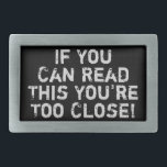You're Too Close Funny Quote Belt Buckle<br><div class="desc">A funny quote in a distressed font. The phrase reads: If you can read this you’re too close.</div>