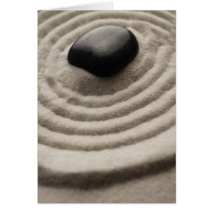 zen garden with pebble detail on raked sand