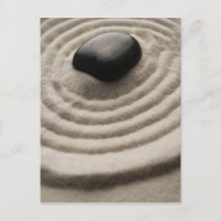 zen garden with pebble detail on raked sand